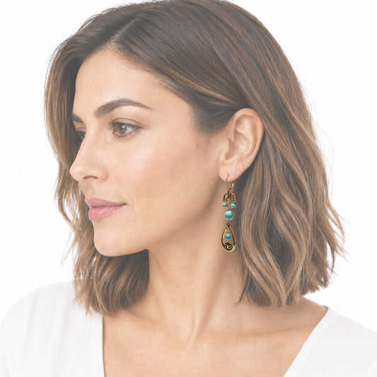 Elegant model with turquoise earrings