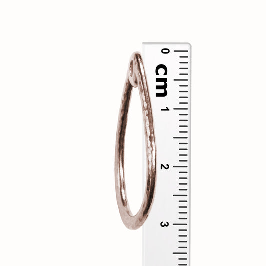 TierraCast Stitch-around Teardrop Charm / plated pewter with an antique copper finish / side view with ruler